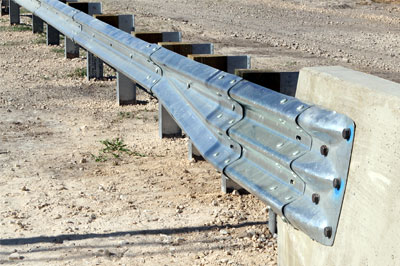 Transition from thrie beam to W beam guardrail fencing L2